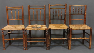 A harlequin set of 4 elm stick and rail back chairs with woven  rush seats