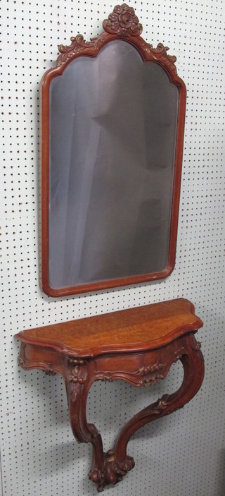 A carved walnut console table with matching arch shaped plate  mirror 23"