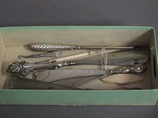 3 silver handled shoe horns, 2 button hooks and 2 needle cases  etc