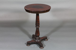 A Victorian circular rosewood occasional table, raised on a turned column with tripod base 18"