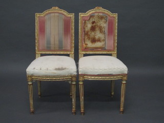 A pair of French style salon chairs with upholstered seats and backs, raised on turned and fluted supports