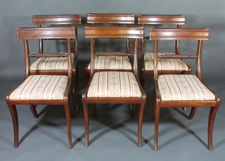 A set of 6 Georgian mahogany bar back dining chairs with rope  mid rails and upholstered drop in seats, raised on front and rear  sabre supports