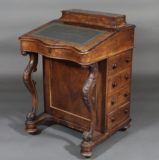 A Victorian figured walnut Davenport desk of serpentine outline, fitted a stationery box, the pedestal fitted 4 long drawers, raised  on cabriole supports 22"  ILLUSTRATED