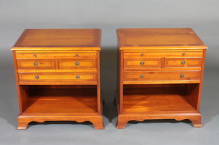 A pair of Georgian style yew bedside chests, fitted a brushing  slide above 2 short and 1 long drawer with recess, raised on  bracket feet 23"