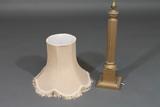A gilt painted fluted table lamp
