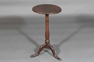 An 18th/19th Century circular elm wine table, raised on pillar  and tripod supports 13"