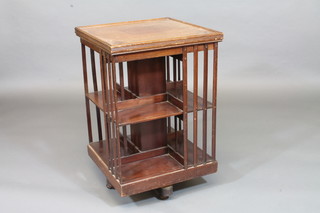 An Edwardian square mahogany revolving bookcase 21"