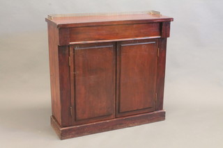 A Victorian mahogany chiffonier with brass railed back fitted 1 long drawer above a double cupboard, raised on a platform base  35"