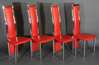 A set of 4 Designer chrome framed high back dining chairs upholstered in bright red rexine