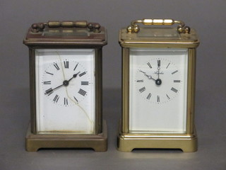 A 19th Century French 8 day carriage clock with enamelled dial, cracked, and Roman numerals, contained in a metal case together  with 1 other