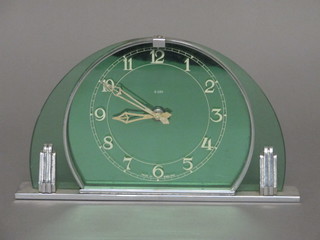 An Art Deco Smiths 8 day mantel clock contained in an arch  shaped glass case