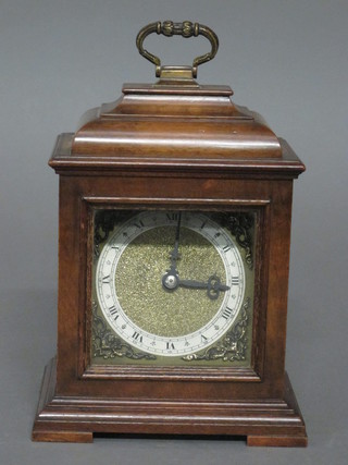 An Elliott bracket clock with 3 1/2" square gilt dial with silvered chapter ring, contained in a walnut case, requires some attention