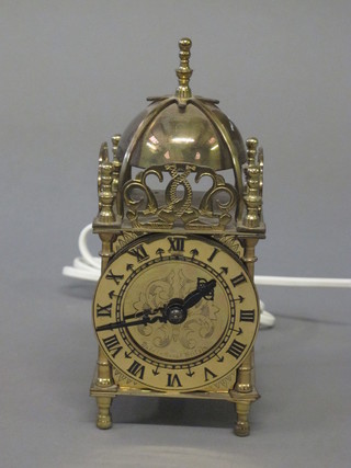 A Smiths electric lantern clock contained in a brass case 3"