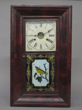 An American 30 hour striking wall clock contained in a  mahogany case