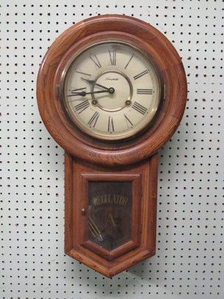 A wall clock with enamelled dial marked Spizit contained in an oak case