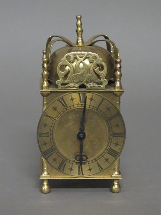A Smiths battery operated lantern clock contained in a gilt case