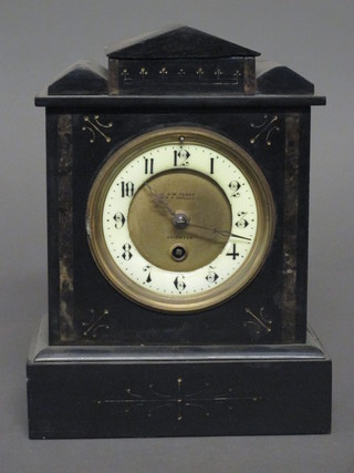 A Victorian French 8 day mantel clock with enamelled dial contained in a black marble architectural case, bezel missing,