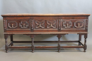 A 19th Century carved oak Jacobean style dresser fitted 3 long drawers, raised on turned and block supports 72"