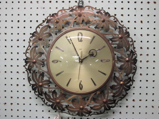 A 1950's electric wall clock with gilt dial contained in a pierced gilt metal case by Metamec