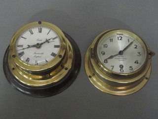 A ward room clock with silvered dial and Arabic numerals by  Wempe Chronometewekr Hamburg 4" and 1 other battery operated