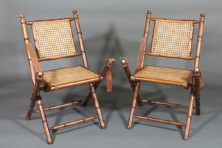 A pair of military style bamboo and woven cane folding  campaign chairs