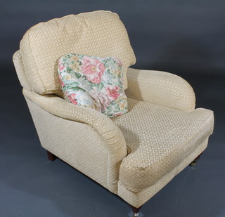 A Victorian style mahogany framed armchair upholstered in  yellow material