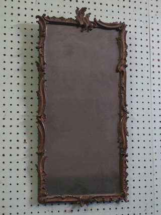 A rectangular plate wall mirror contained in a decorative gilt  frame 18"