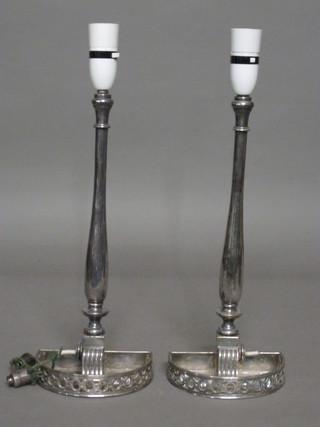 A pair of silver plated table lamps 14"