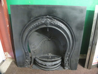 A reproduction Victorian cast iron fire place insert 37"