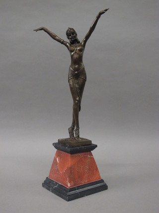 An Art Deco style bronze figure of a dancing lady, raised on a shaped marble base 20"