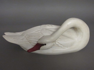 A James Haddon carved wooden figure of a swan 