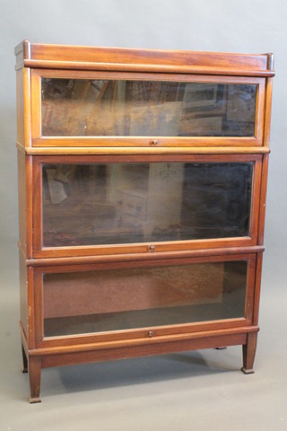 A mahogany Globe Wernicke style 3 tier bookcase, raised on square supports 34"