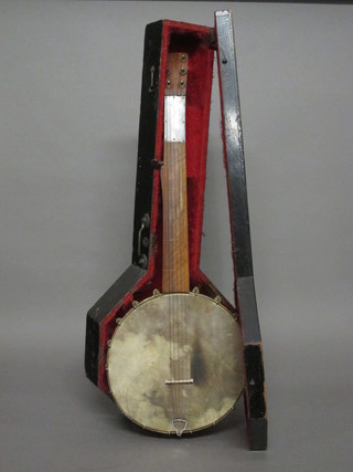 A 6 stringed banjolele complete with wooden carrying case