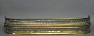 A Victorian pierced brass fender 41"