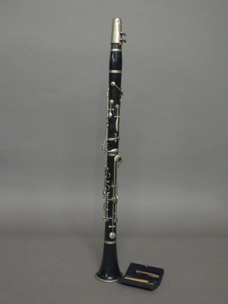 A 3 piece clarinet marked Hawkes & Sons