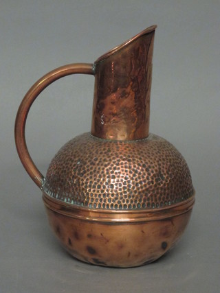 A planished copper jug by Loveridge & Co, the base marked RD  17067, 11"  ILLUSTRATED