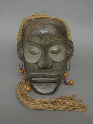 An Eastern carved mask 12"