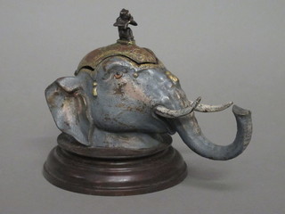 A bronze painted inkwell in the form of an elephants mask 7"