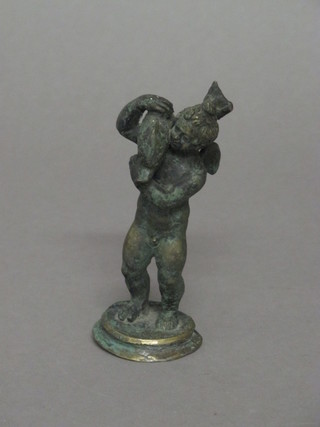A bronze figure of a standing cherub 4 1/2"