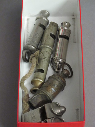 A Metropolitan pattern double ended whistle, an Acme scout  whistle, 2 Acme Thunder whistles and 1 other