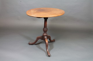 A 19th Century oval bleached mahogany snap top wine table,  raised on pillar and tripod supports 29"
