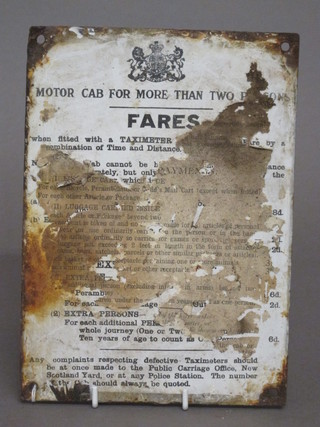 An enamelled sign - Motorcab for 2 persons fares, 9" x 6 1/2"  some corrosion