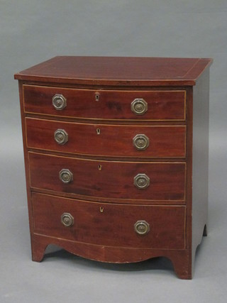 A mahogany bow front chest of 4 long drawers with satinwood stringing, raised on bracket feet 22"