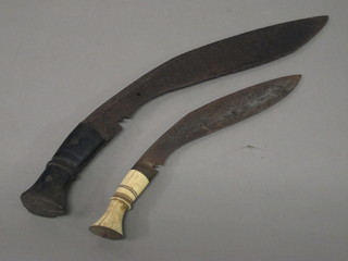 A Kukri with 4 1/2" blade together with 1 other with 8 1/2"  blade and ivory handle