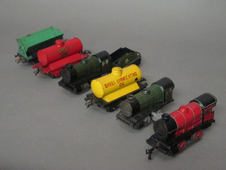 A Meccano Hornby O gauge clock work locomotive, a Meccano  Hornby O gauge Shell Motor Spirit tanker, do. Shell Motor Lubrications and a McAlpine Tipper Truck