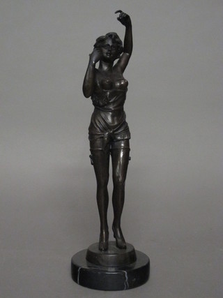 A bronze figure of a standing lady raised on a circular marble  base 17"