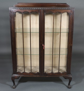 A 1930's Art Deco mahogany display cabinet, the interior fitted  shelves enclosed by astragal glazed panelled doors, raised on  cabriole ball and claw supports 34 1/2"