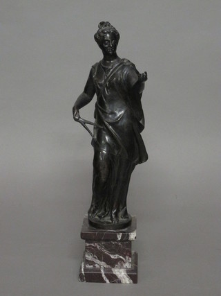 A bronze figure of a standing lady raised on a square marble base 18"