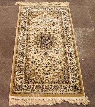 A white and gold coloured machine made Persian style rug 59" x 31"