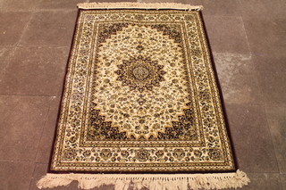 A red ground and floral pattern Persian style cotton rug with  central medallion 63" x 46"